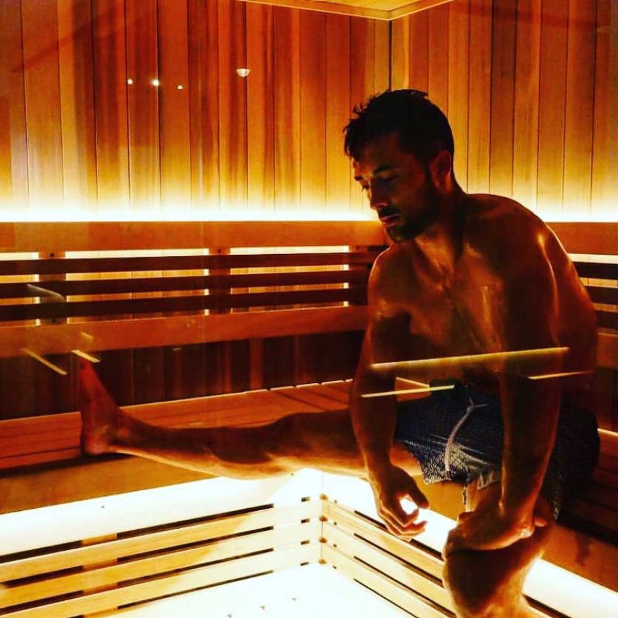 A man spreads out in a sauna at Remedy Chiropractic + Cryospa in San Juan, Puerto Rico.