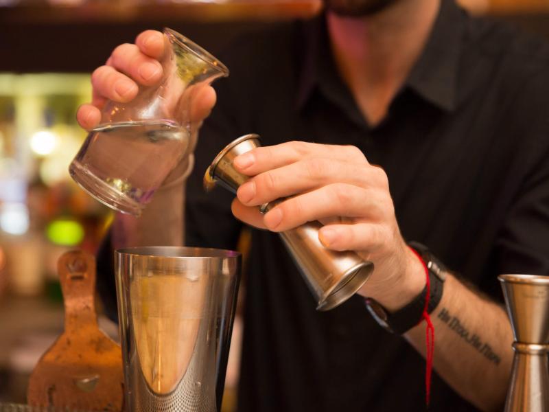 A bartender mixes cocktails at Gallo Negro 