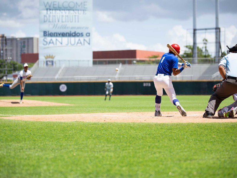 A batter stands at the plate prepared to swing during a baseball game in Puerto Rico.