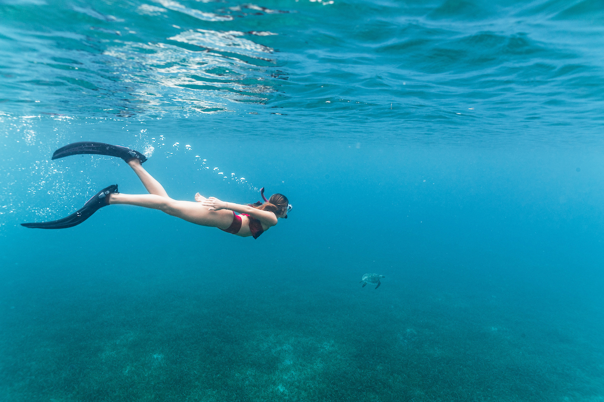 A girl snorkles in Culebra