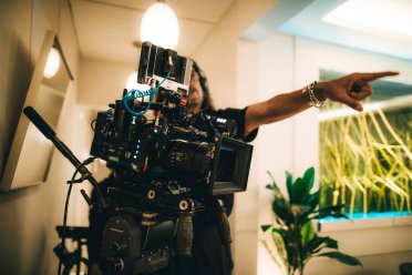 Filmographer behind the camera.