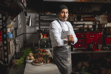 Chef Carlos Portela poses in his kitchen