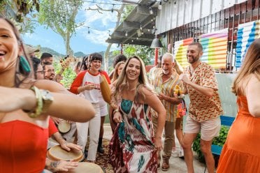 Woman dancing with a musical group.