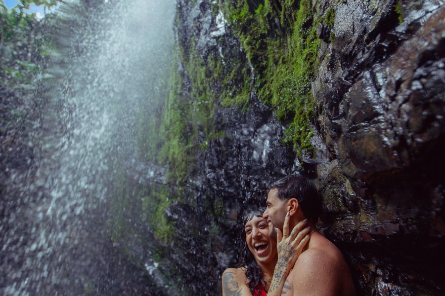 Couple under a waterfall in El Yunque.