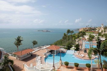 Wide view of El Conquistador Resort, which sits on a hillside and overlooks the ocean in Fajardo, Puerto Rico.