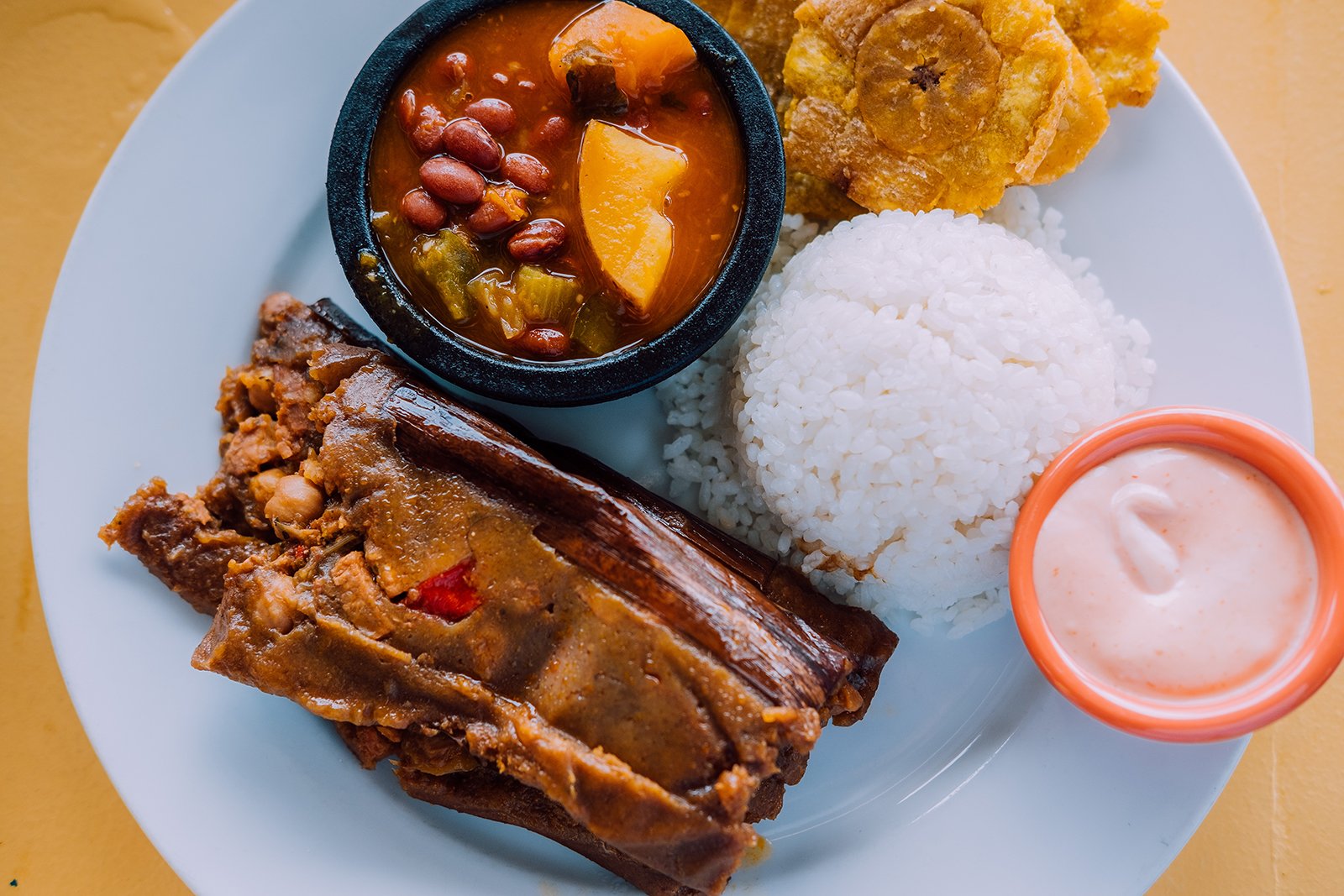 Traditional rice and beans plate with tostones.