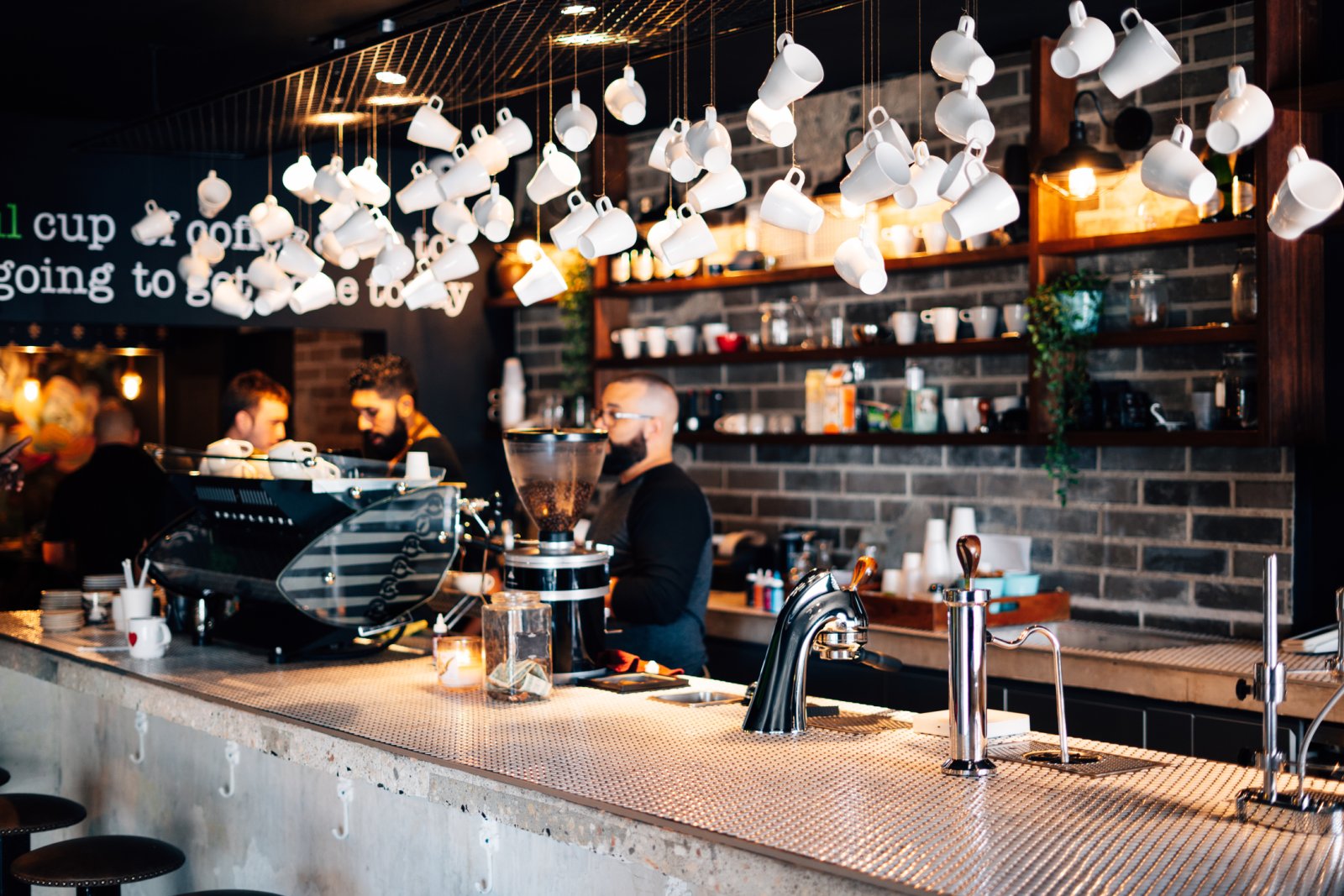 Decorative coffee cups hang from the ceiling at Bistro Cafe in Carolina.