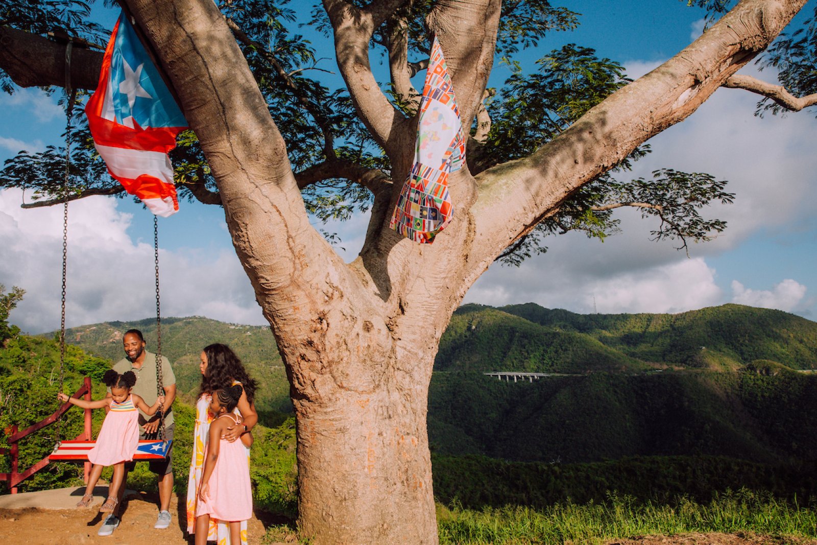 A family enjoys the swing at