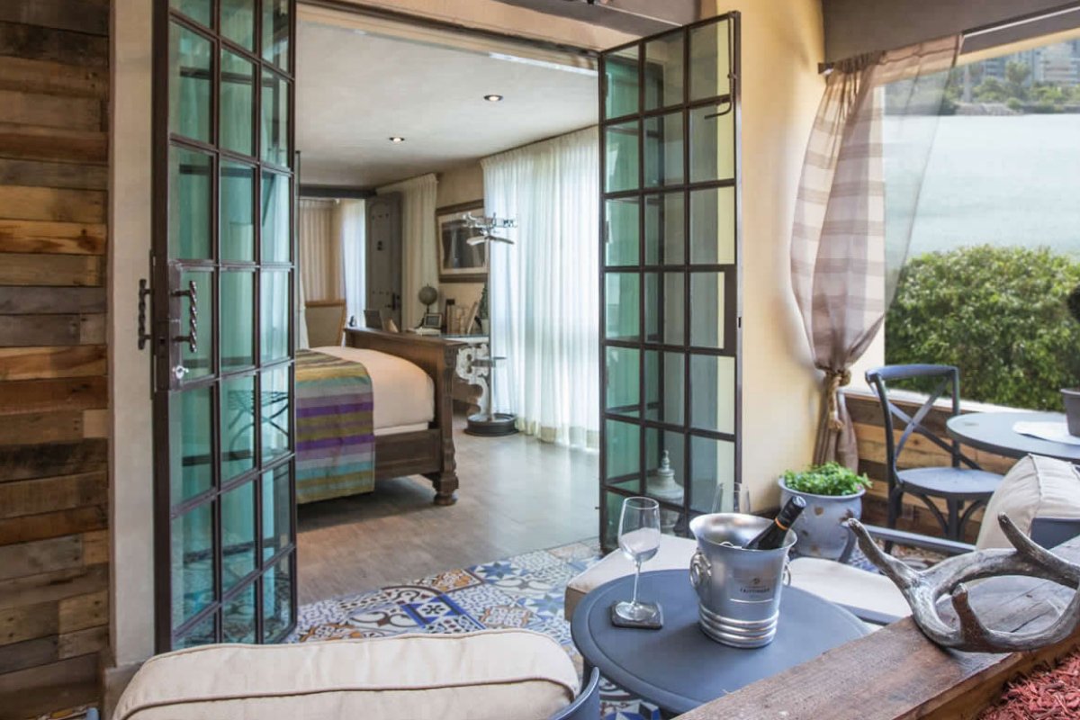 The rooms at the O:Live Boutique Hotel have an enchanted bohemian quality to them along with views of San Juan's lagoon.