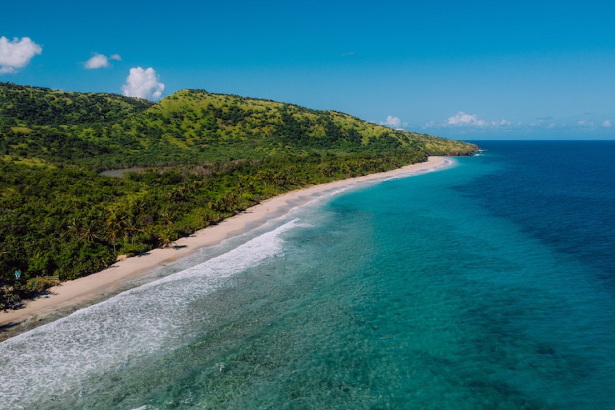 Waves crash along a beach in Culebra.