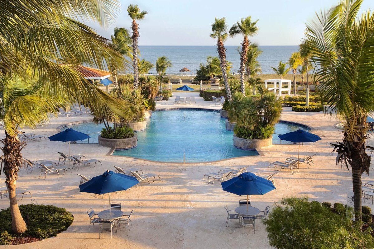 Relaxing poolside at the Hilton Ponce Golf & Casino Resort. 