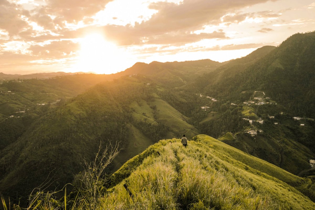 Hiker admiring the view of Puerto Rico's mountains. 