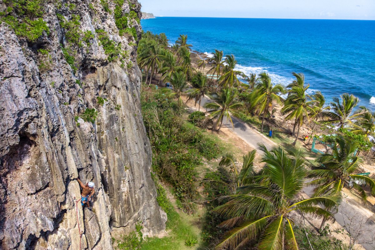 A man rock climbs.