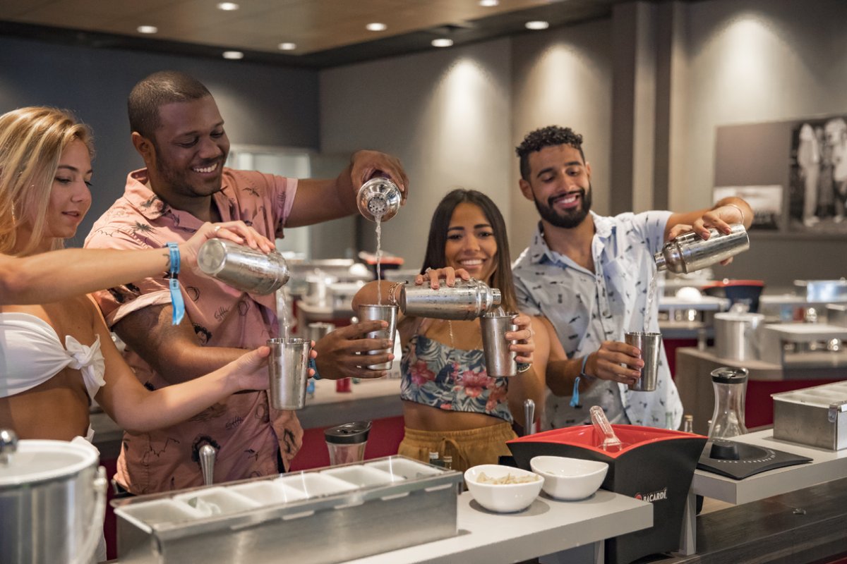 A group of people enjoy a cocktail mixology class at Casa Bacardi Rum Distillery.