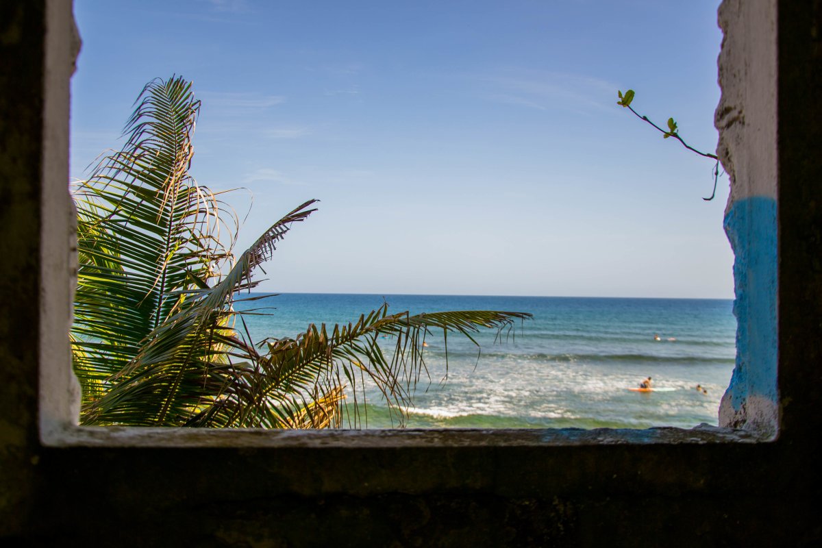 A surfer waits for a wave at Surfer's Beach in Aguadilla.