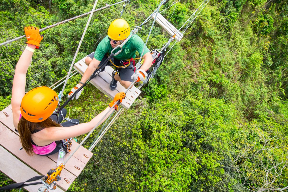A team works together on the zipline course at Toro Verde Adventure Park.