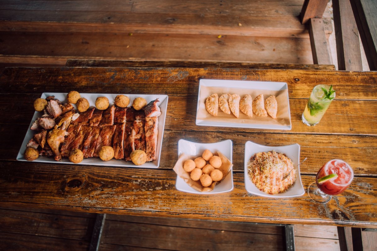 An array of plates on a table at ASAO Smokehouse