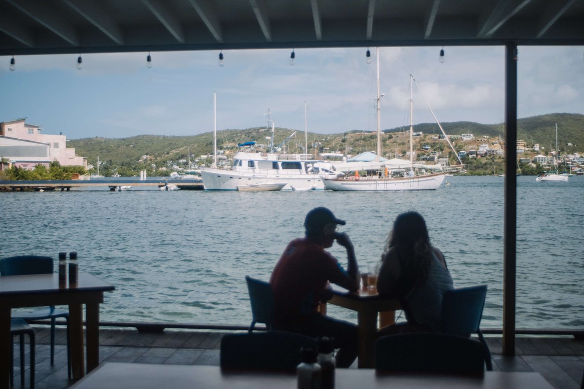 A couple dines and enjoys the views at the Dinghy Dock in Culebra. 