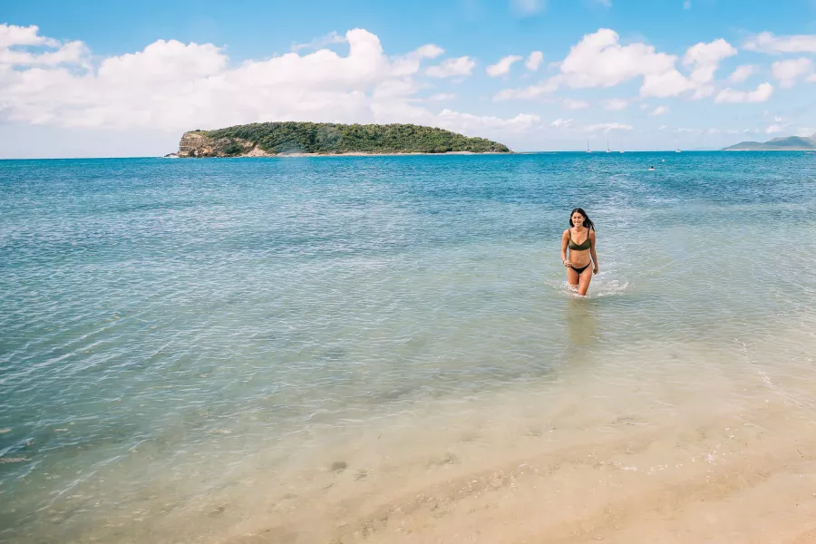 Woman enjoying the clear waters at La Esperanza Beach in Vieques, known for the best snorkeling in Puerto Rico.