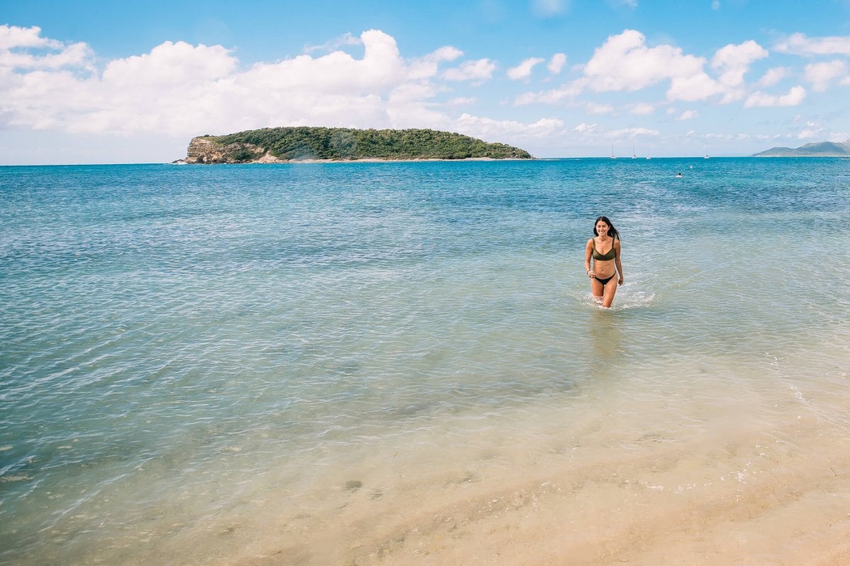 Woman enjoying the clear waters at La Esperanza Beach in Vieques.