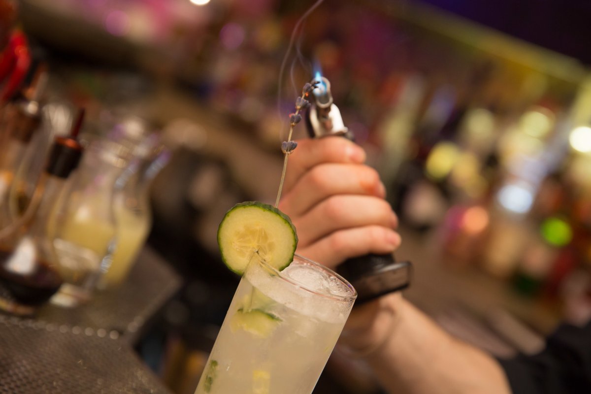 A bartender prepares an elaborate craft cocktail at Gallo Negro.