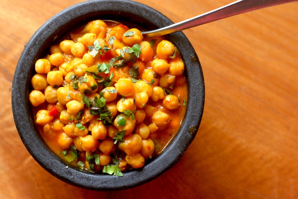 A cup of garbanzada, which is a Puerto Rican chickpea stew.