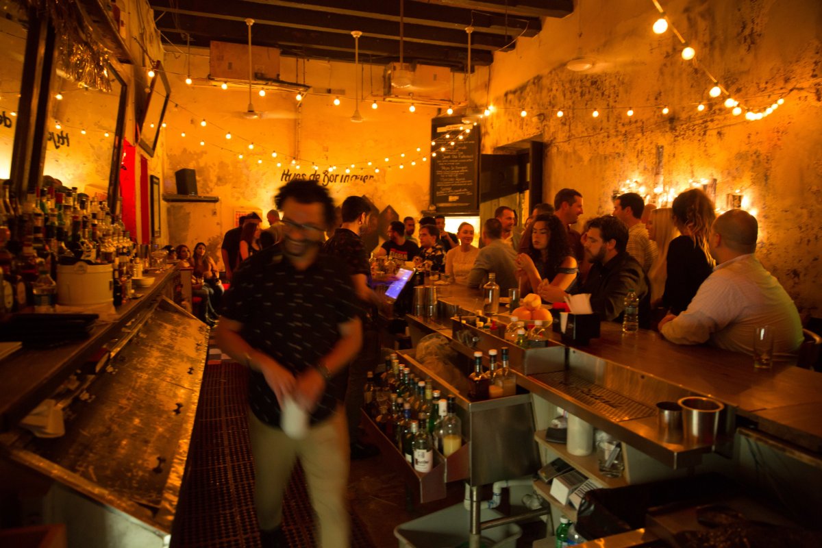 The dimly lit barroom of La Factoria in Old San Juan.