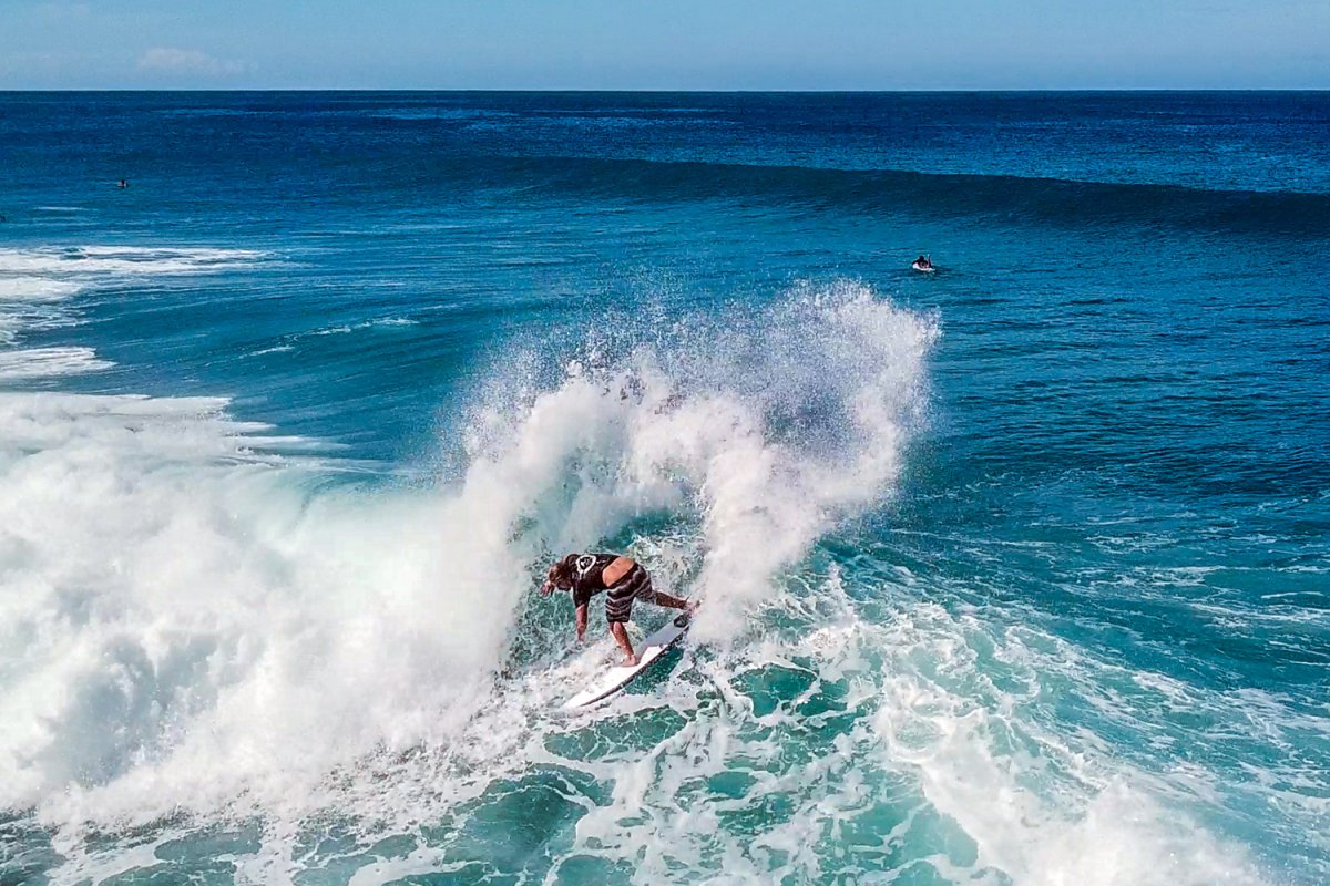 A surfer cruising a wave in Rincón.