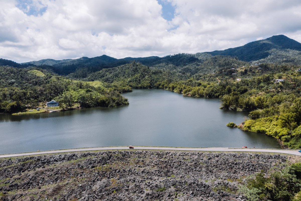 Lago Garzas in Adjuntas with mountains in the background