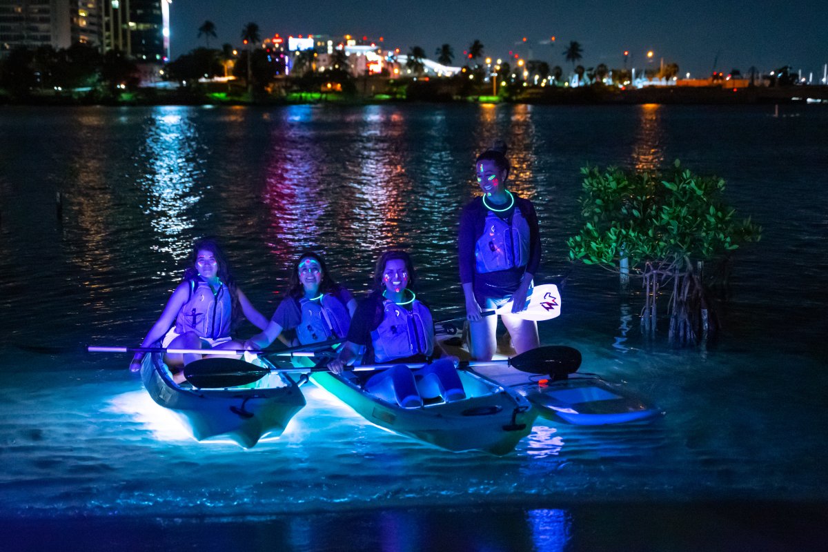 A group kayaks through the Condado Lagoon. 