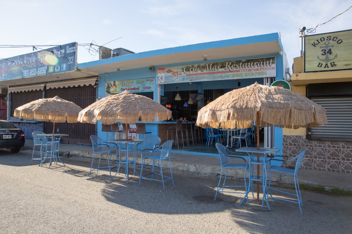 Tables and chairs in front of the food kiosks