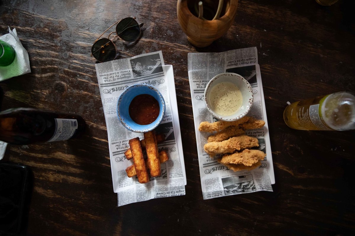 Plates of fritters and bottles of beer from Biekes Bistro in Vieques