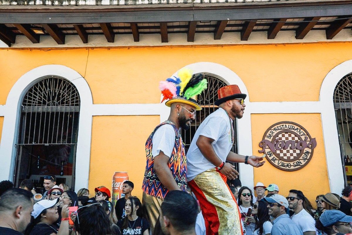 People celebrating Fiestas de la Calle San Sebastián in Old San Juan, part of the vibrant Christmas celebrations in Puerto Rico.