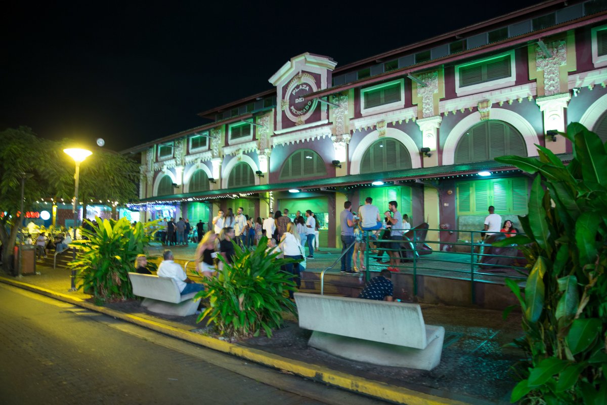 La Placita in San Juan at dusk, filled with people and vibrant energy