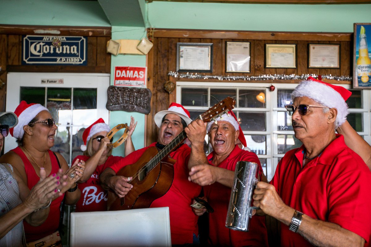 Each parrandero has a role, from playing an instrument, singing, or clapping to the beat of the songs.