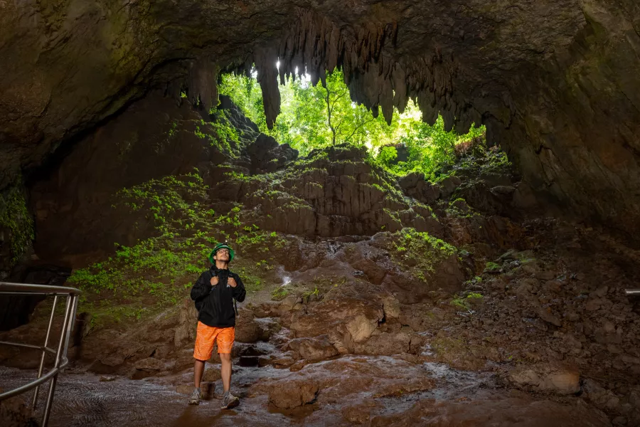 Hiker exploring Río Camuy Cave Park during a 3-day adventure in Puerto Rico