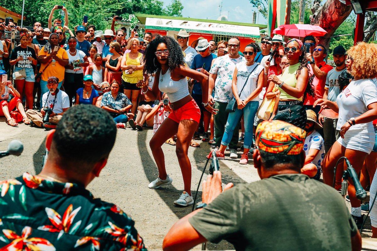 A woman dances bomba at the Hermanos Ayala batey.