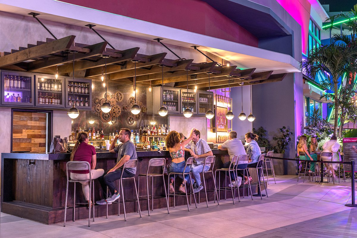 Bargoers enjoy cocktails at La Barrita del Lado at Distrito T-Mobile