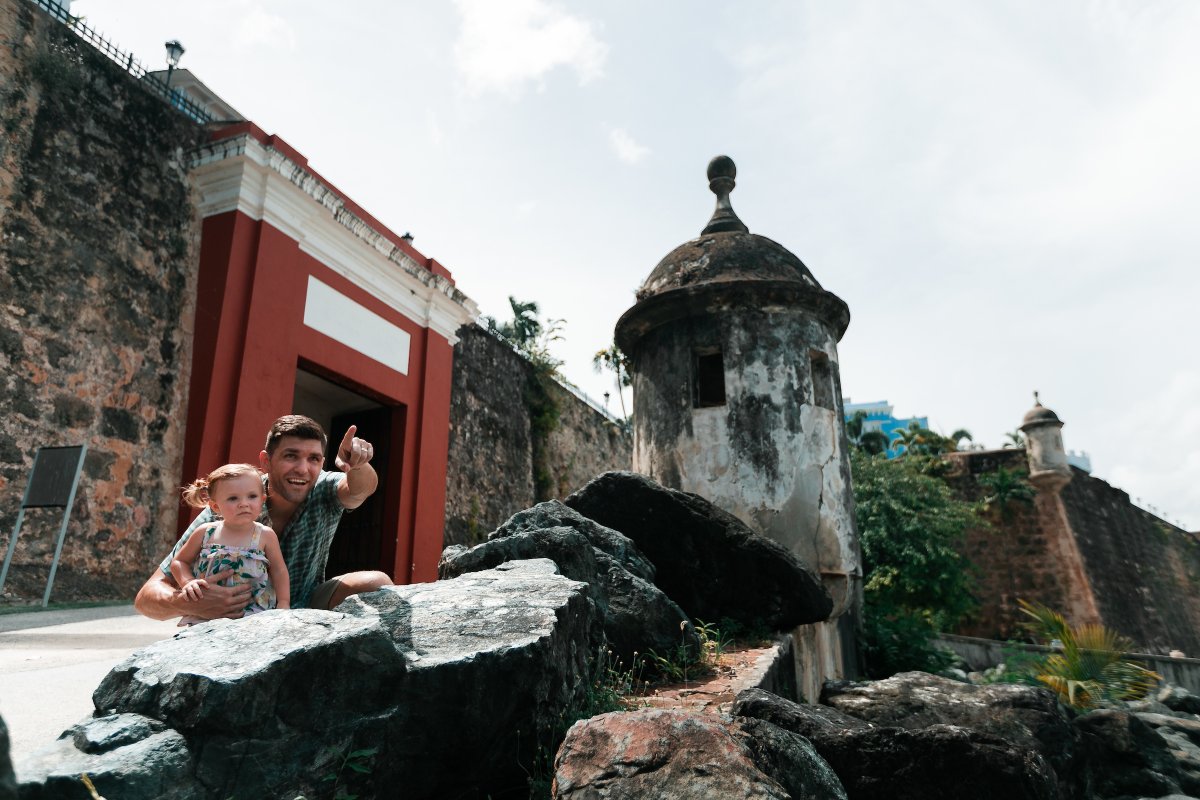 A family explores the Old San Juan city walls