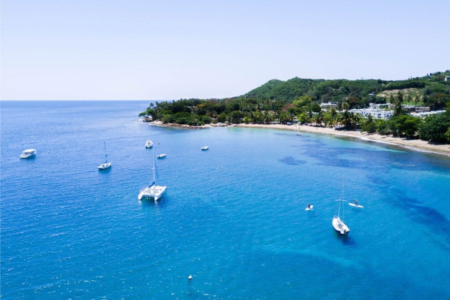 Boats anchored off a beautiful beach in Puerto Rico
