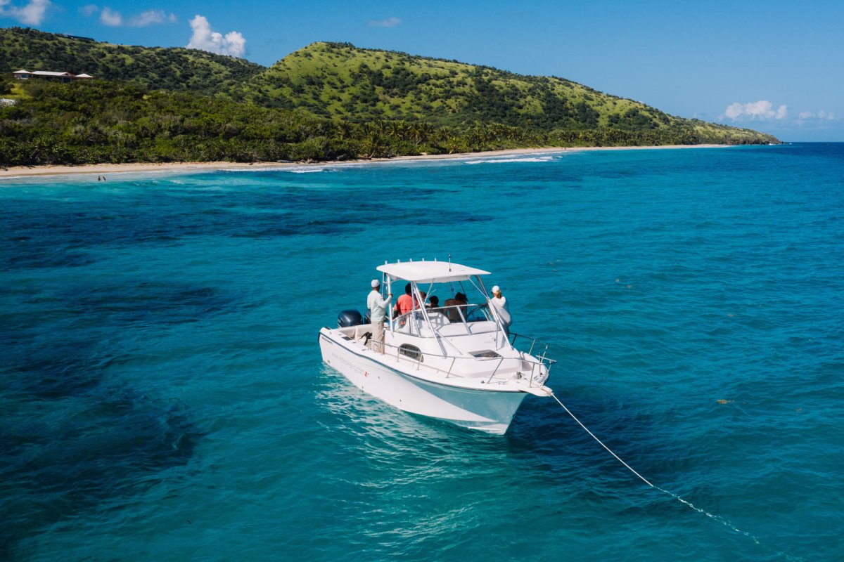 A boat anchored off a beautiful beach in Puerto Rico