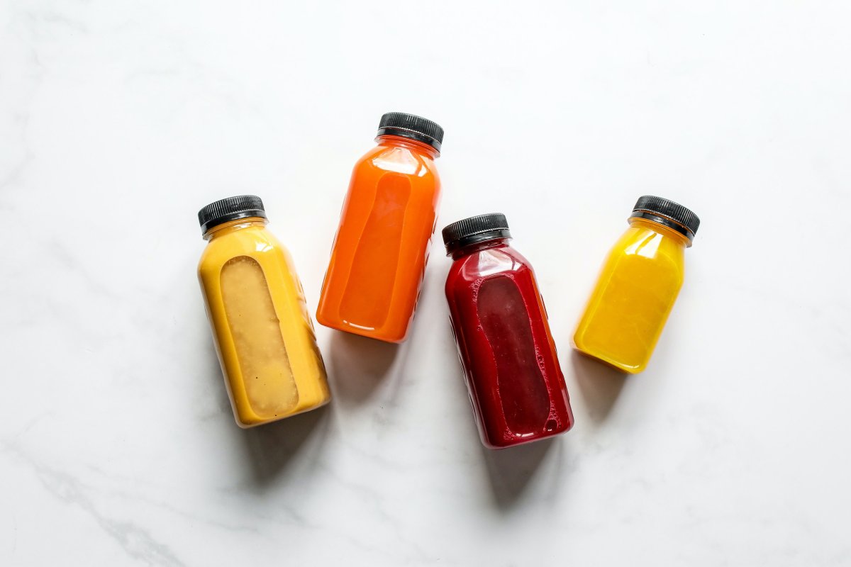 Four different fresh-pressed juices.
