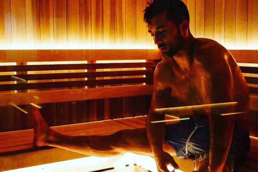 A man spreads out in a sauna at Remedy Chiropractic + Cryospa in San Juan, Puerto Rico.