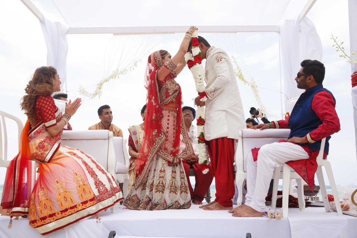 A couple get married during a traditional Indian wedding ceremony.
