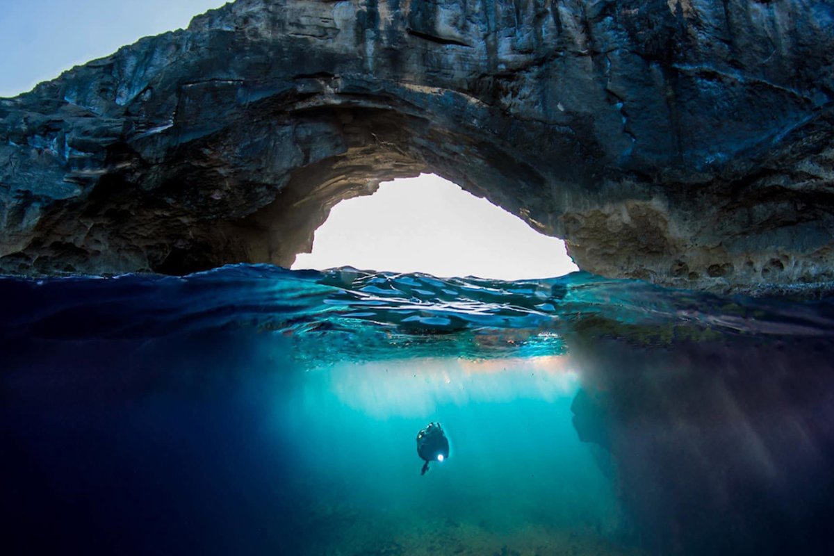 A scuba diver exploring the Cueva del Indio in Puerto Rico.