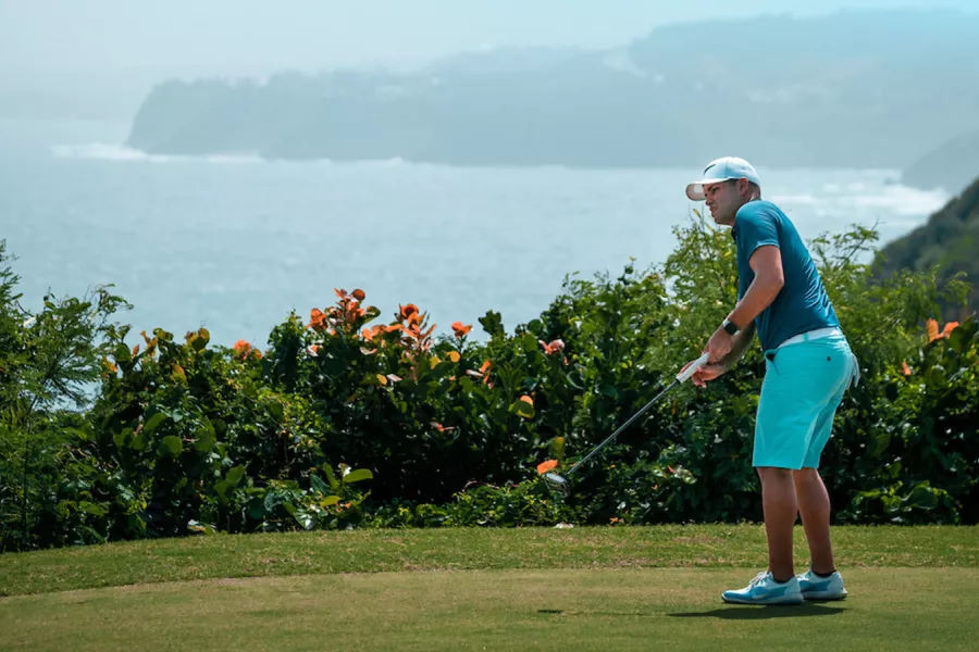 Man golfing at The Links at Royal Isabela, an oceanfront golf course in Isabela, Puerto Rico.