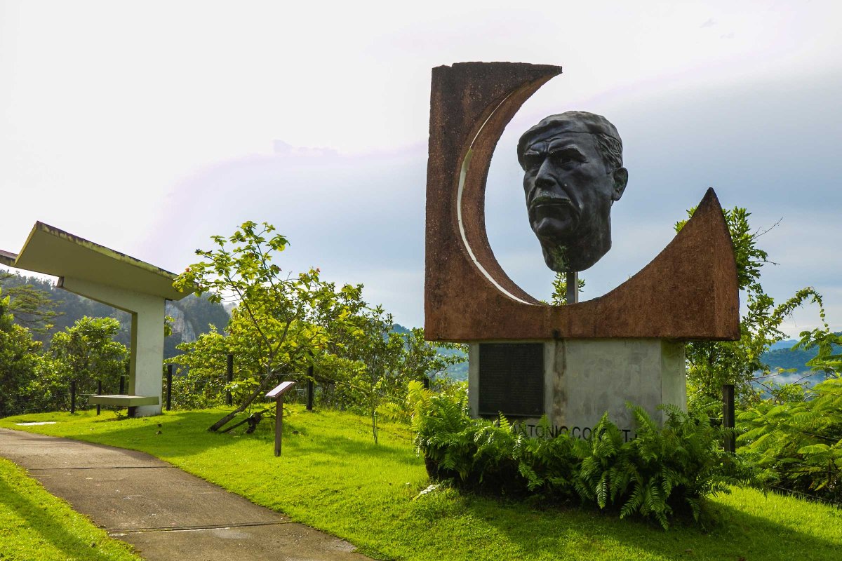A large bust of Puerto Rican poet Juan Antonio Corretjer overlooks a mountain view at Paseo Lineal Juan Antonio Corretjer in Ciales, PR.