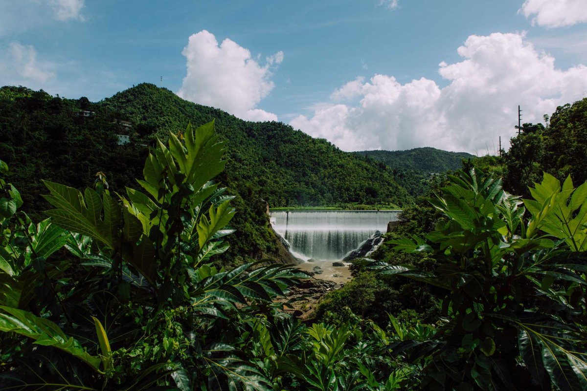 El Salto dam is pictured in Comerío in a picturesque setting of mountains and lush foliage.
