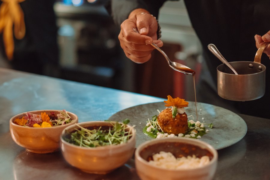 Chef plating dishes.
