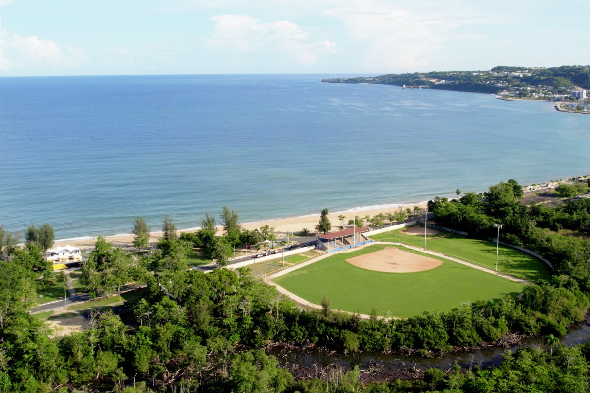 Aerial view of baseball field and beach.